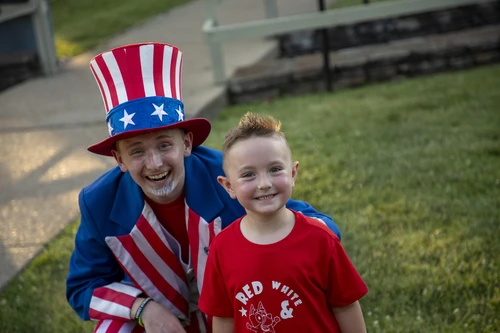 Boy with hat with younger boy 
